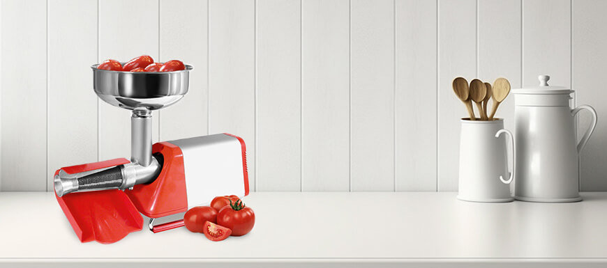 Spremy tomato strainer machine sitting on kitchen counter